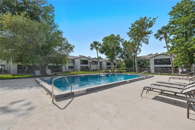 1 Tomoka Oaks Blvd Unit 135, Ormond Beach, FL 32174 - community pool featuring a patio and a residential view