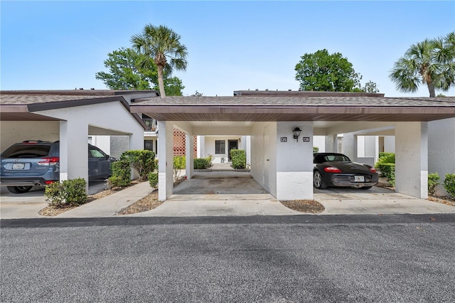 1 Tomoka Oaks Blvd Unit 135, Ormond Beach, FL 32174 - view of covered parking lot