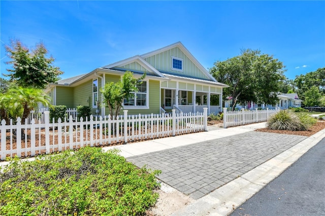 47 Hidden Treasure Dr, Palm Coast, FL 32137 - view of front of house with board and batten siding and covered porch