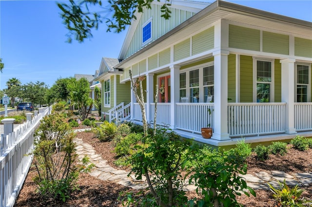 47 Hidden Treasure Dr, Palm Coast, FL 32137 - view of side of property featuring covered porch and board and batten siding