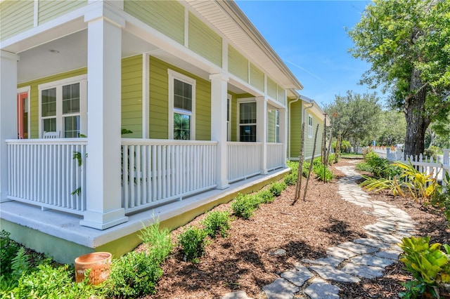 47 Hidden Treasure Dr, Palm Coast, FL 32137 - view of side of property with a porch