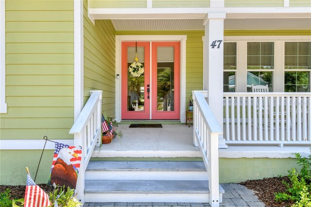 47 Hidden Treasure Dr, Palm Coast, FL 32137 - view of exterior entry featuring covered porch