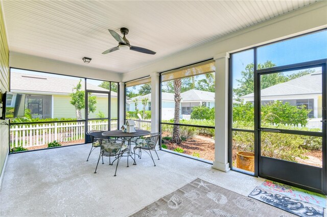 47 Hidden Treasure Dr, Palm Coast, FL 32137 - sunroom / solarium featuring ceiling fan and outdoor dining space