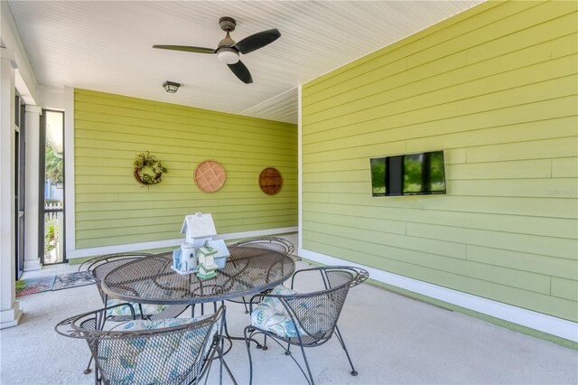 47 Hidden Treasure Dr, Palm Coast, FL 32137 - view of patio featuring outdoor dining area and a ceiling fan
