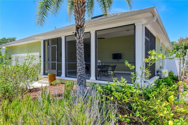 47 Hidden Treasure Dr, Palm Coast, FL 32137 - view of side of home featuring a sunroom