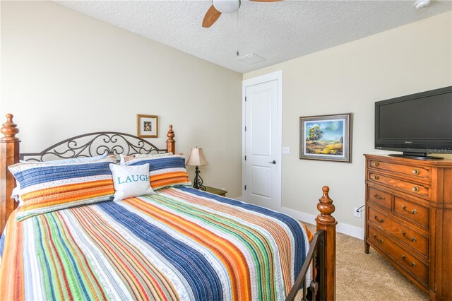 47 Hidden Treasure Dr, Palm Coast, FL 32137 - bedroom with light colored carpet, a textured ceiling, and ceiling fan