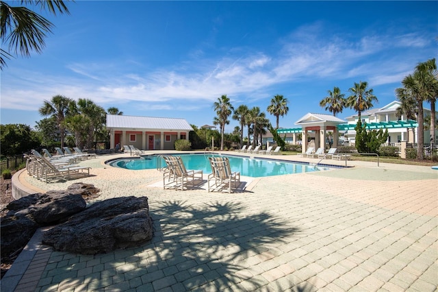 47 Hidden Treasure Dr, Palm Coast, FL 32137 - community pool featuring a patio
