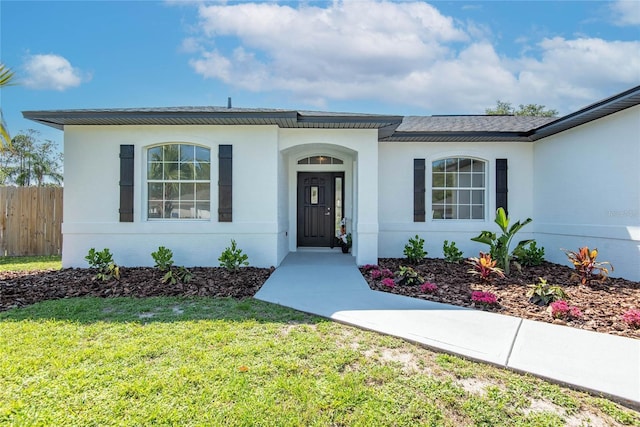 8 Zelda Ct, Palm Coast, FL 32164 - property entrance with stucco siding