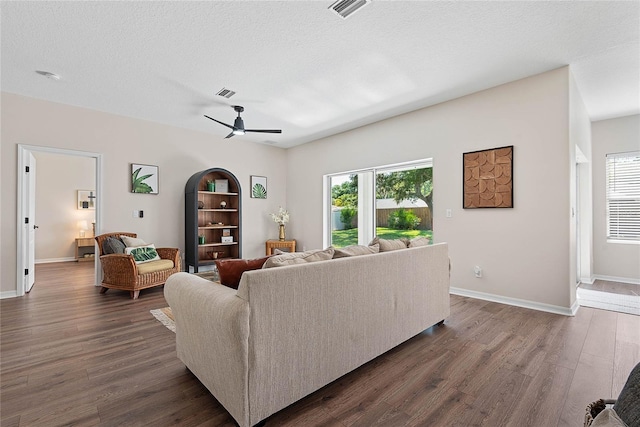 8 Zelda Ct, Palm Coast, FL 32164 - living room featuring dark wood-style floors, ceiling fan, and baseboards