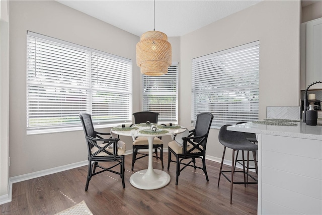 8 Zelda Ct, Palm Coast, FL 32164 - dining space featuring wood finished floors and baseboards