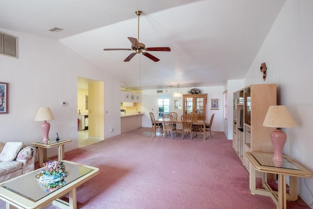 13 Point Of Woods Dr, Palm Coast, FL 32164 - carpeted living room with vaulted ceiling and a ceiling fan