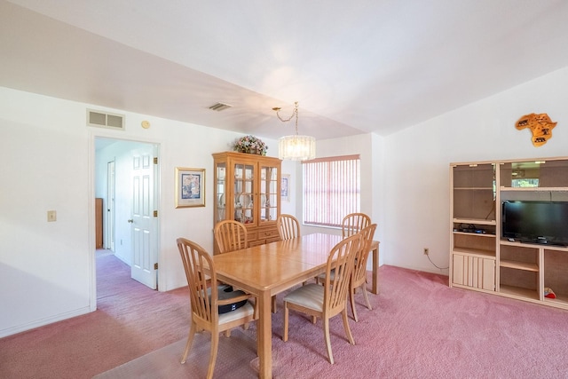 13 Point Of Woods Dr, Palm Coast, FL 32164 - dining room with light colored carpet, a chandelier, and vaulted ceiling