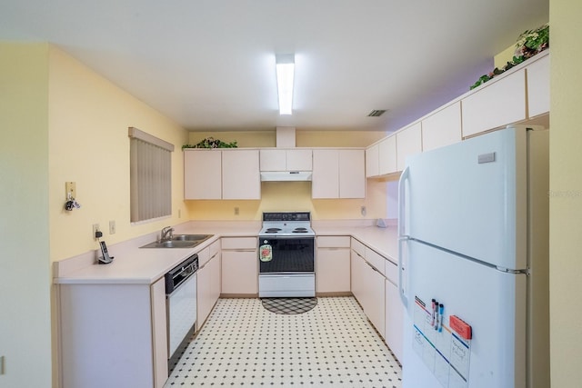 13 Point Of Woods Dr, Palm Coast, FL 32164 - kitchen featuring white appliances, under cabinet range hood, a sink, light countertops, and light flooring