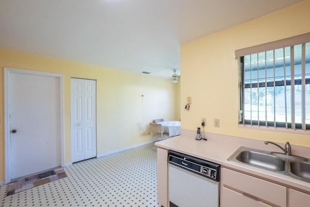 13 Point Of Woods Dr, Palm Coast, FL 32164 - kitchen with white dishwasher, a sink, white cabinetry, light countertops, and ceiling fan