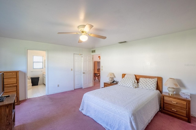 13 Point Of Woods Dr, Palm Coast, FL 32164 - carpeted bedroom with a ceiling fan, ensuite bath, and baseboards