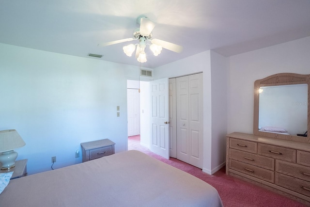 13 Point Of Woods Dr, Palm Coast, FL 32164 - bedroom with carpet flooring, a closet, and a ceiling fan