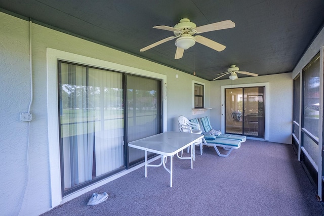 13 Point Of Woods Dr, Palm Coast, FL 32164 - sunroom / solarium featuring carpet flooring, ceiling fan, and a textured wall