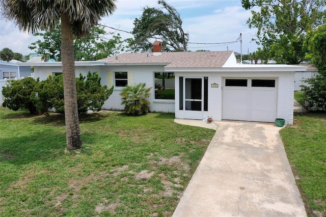 168 Palmetto Ave, Flagler Beach, FL 32136 - ranch-style house featuring a front lawn, a chimney, roof with shingles, concrete driveway, and an attached garage