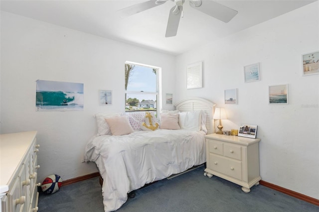 168 Palmetto Ave, Flagler Beach, FL 32136 - bedroom featuring dark colored carpet, a ceiling fan, and baseboards