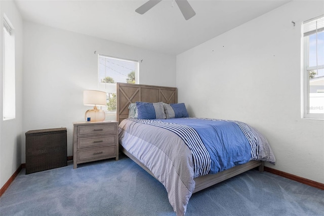 168 Palmetto Ave, Flagler Beach, FL 32136 - bedroom featuring multiple windows, carpet flooring, baseboards, and a ceiling fan