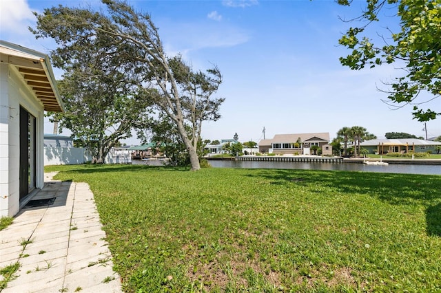 168 Palmetto Ave, Flagler Beach, FL 32136 - view of grassy yard with a water view and a residential view