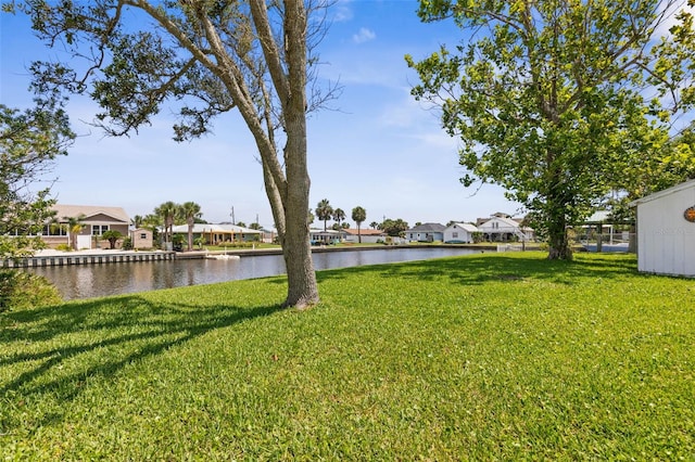 168 Palmetto Ave, Flagler Beach, FL 32136 - view of green lawn with a water view and a residential view