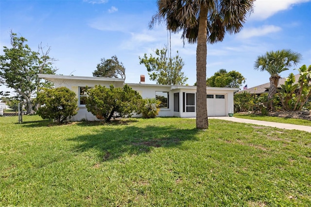 168 Palmetto Ave, Flagler Beach, FL 32136 - view of front of property with a garage, concrete driveway, and stucco siding