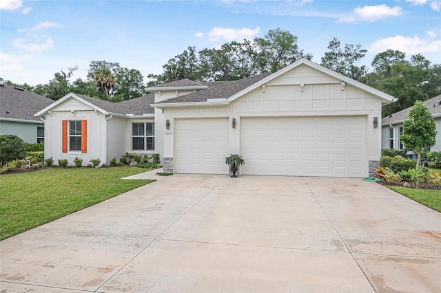 3029 Adrian Dr, Ormond Beach, FL 32174 - view of front of home featuring an attached garage, driveway, a shingled roof, board and batten siding, and a front lawn