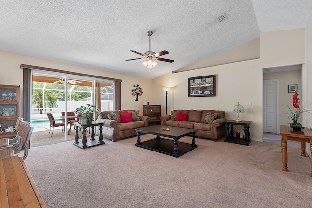 18 Royal Palm Ln, Palm Coast, FL 32164 - living room with carpet floors, ceiling fan, a textured ceiling, and vaulted ceiling