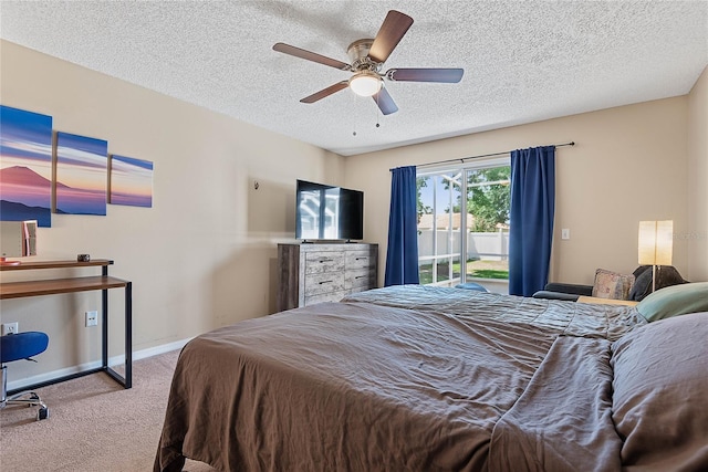 18 Royal Palm Ln, Palm Coast, FL 32164 - carpeted bedroom featuring access to outside, a textured ceiling, baseboards, and a ceiling fan