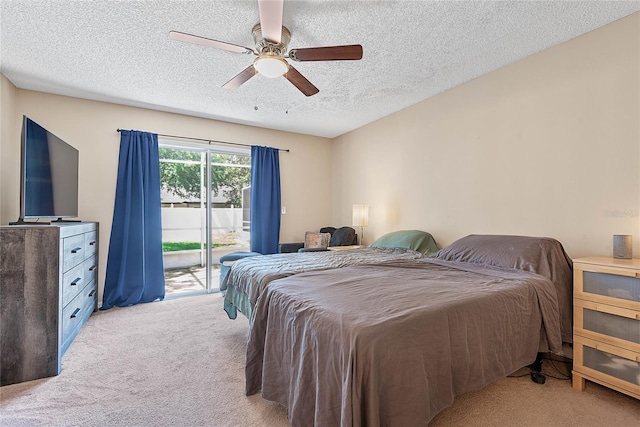 18 Royal Palm Ln, Palm Coast, FL 32164 - bedroom featuring access to outside, light carpet, a textured ceiling, and a ceiling fan