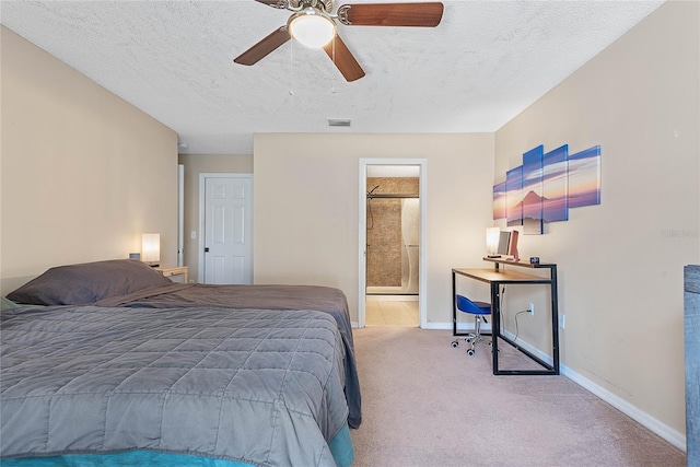 18 Royal Palm Ln, Palm Coast, FL 32164 - carpeted bedroom with baseboards, a textured ceiling, a ceiling fan, and ensuite bathroom