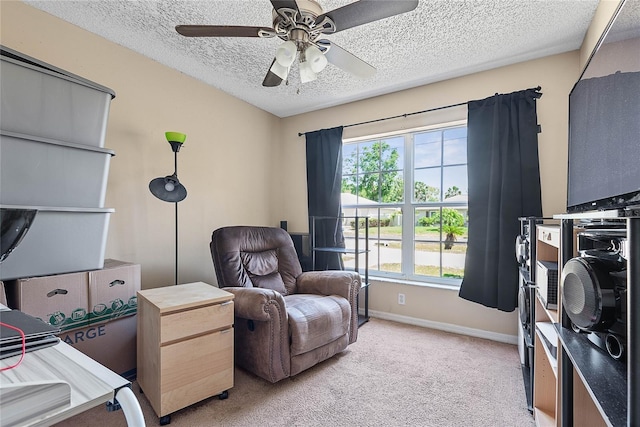 18 Royal Palm Ln, Palm Coast, FL 32164 - living area with a textured ceiling, light colored carpet, ceiling fan, and baseboards