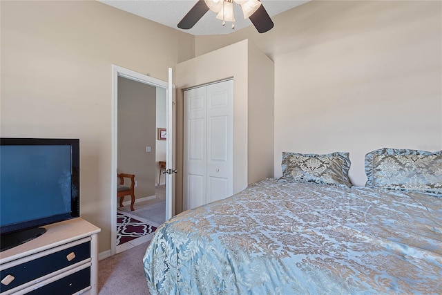 18 Royal Palm Ln, Palm Coast, FL 32164 - bedroom with carpet, a closet, vaulted ceiling, and a ceiling fan