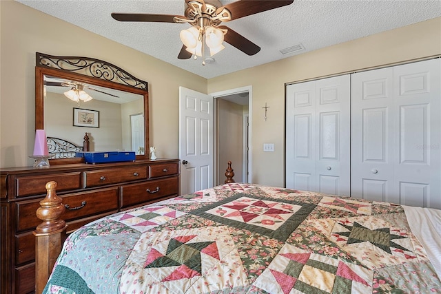18 Royal Palm Ln, Palm Coast, FL 32164 - bedroom featuring a closet, a textured ceiling, and a ceiling fan
