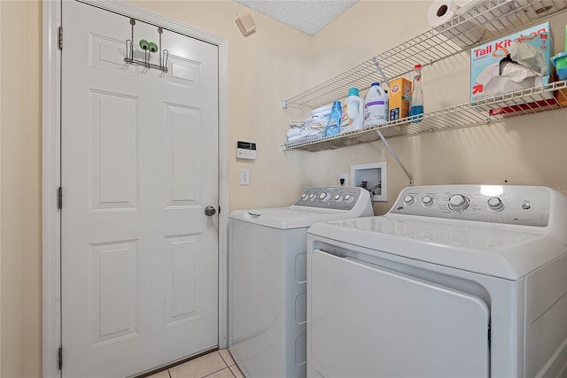 18 Royal Palm Ln, Palm Coast, FL 32164 - laundry area featuring separate washer and dryer and light tile patterned floors