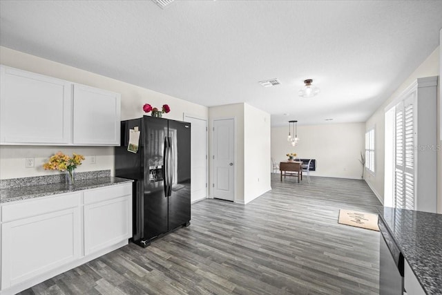 6 Ryding Ln, Palm Coast, FL 32164 - kitchen featuring black refrigerator with ice dispenser, dark wood-type flooring, white cabinets, dishwasher, and dark stone countertops