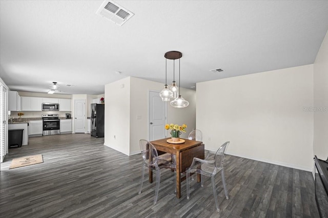 6 Ryding Ln, Palm Coast, FL 32164 - dining room featuring dark wood-type flooring, baseboards, and ceiling fan