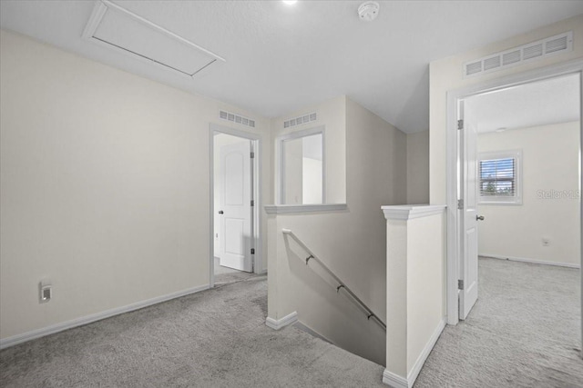 6 Ryding Ln, Palm Coast, FL 32164 - corridor featuring an upstairs landing, carpet flooring, baseboards, and attic access