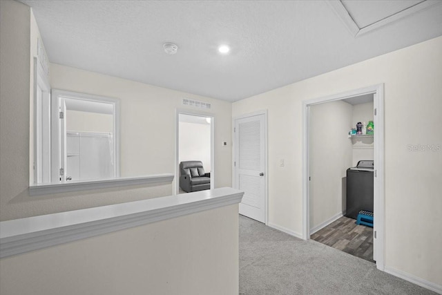 6 Ryding Ln, Palm Coast, FL 32164 - hall featuring washer / clothes dryer, carpet flooring, and baseboards