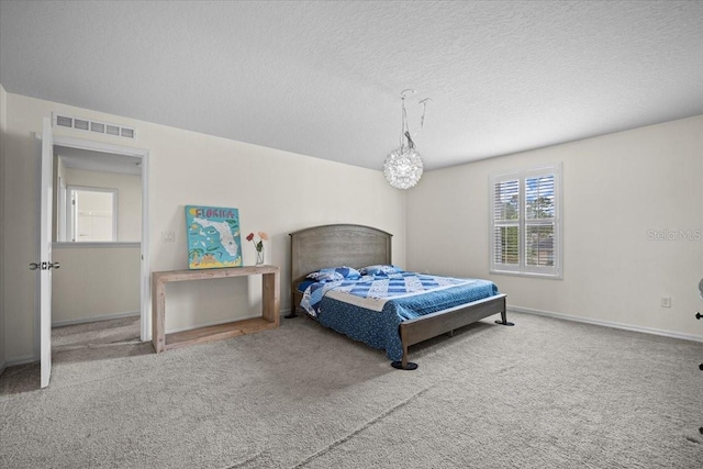 6 Ryding Ln, Palm Coast, FL 32164 - bedroom featuring carpet flooring, baseboards, and a textured ceiling