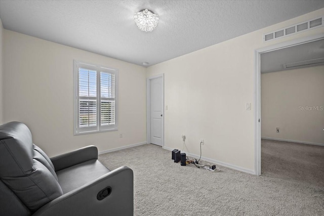 6 Ryding Ln, Palm Coast, FL 32164 - sitting room featuring carpet, a textured ceiling, and baseboards