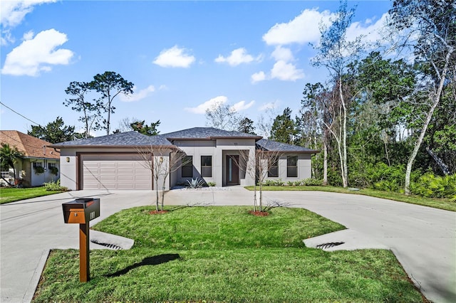 11 Ethan Allen Dr, Palm Coast, FL 32164 - prairie-style home featuring curved driveway, a garage, stucco siding, and a front yard
