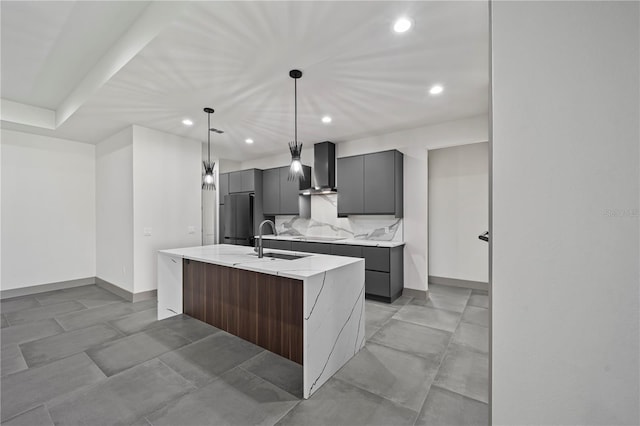 11 Ethan Allen Dr, Palm Coast, FL 32164 - kitchen with refrigerator, wall chimney range hood, gray cabinets, recessed lighting, and a center island with sink