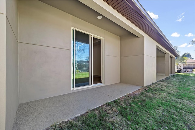 11 Ethan Allen Dr, Palm Coast, FL 32164 - view of property exterior featuring stucco siding and a yard