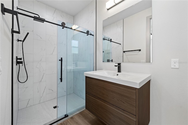 11 Ethan Allen Dr, Palm Coast, FL 32164 - bathroom with vanity, a marble finish shower, and wood finished floors
