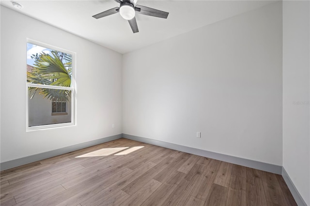 11 Ethan Allen Dr, Palm Coast, FL 32164 - unfurnished room with light wood finished floors, ceiling fan, and a smoke detector