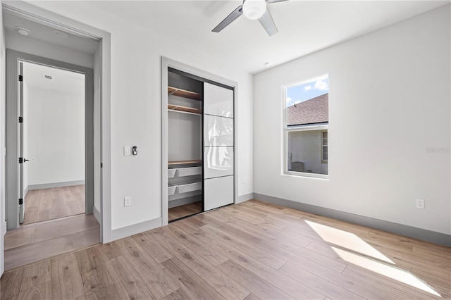 11 Ethan Allen Dr, Palm Coast, FL 32164 - unfurnished bedroom with wood finished floors, a closet, and ceiling fan