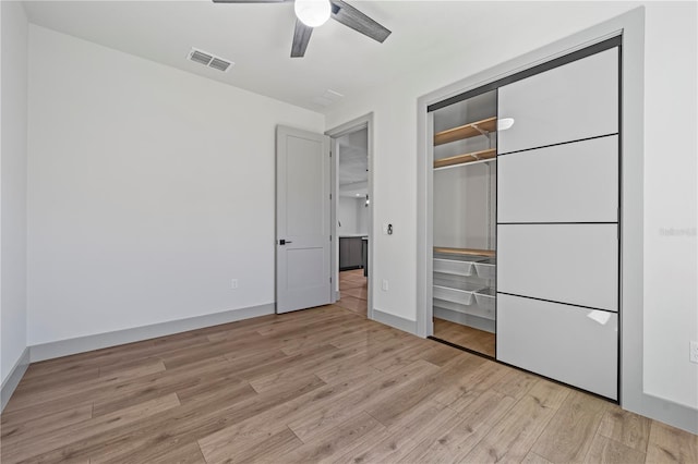 11 Ethan Allen Dr, Palm Coast, FL 32164 - unfurnished bedroom featuring light wood-type flooring, a closet, and a ceiling fan