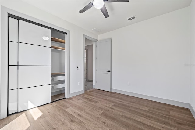11 Ethan Allen Dr, Palm Coast, FL 32164 - unfurnished bedroom featuring light wood-style floors, a closet, and ceiling fan
